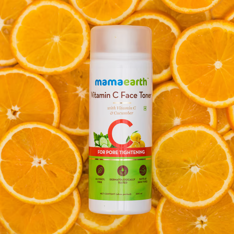 Mamaearth vitamin c with orange fruit background