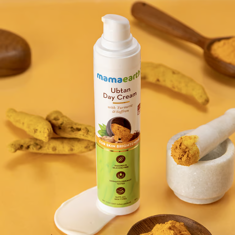 Mamaearth ubtan day cream with turmeric background