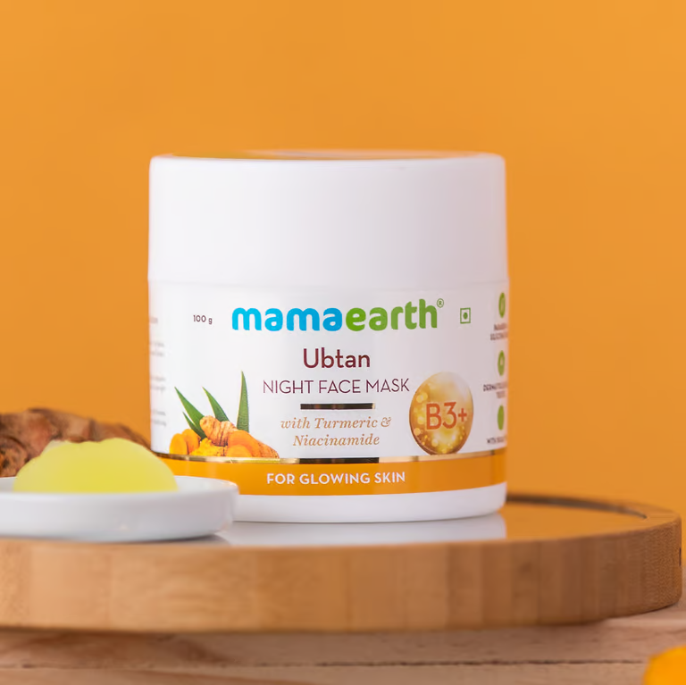 Mamaearth ubtan night face mask with orange color background